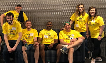Seven Quantum Workplace employees volunteering at the Special Olympics