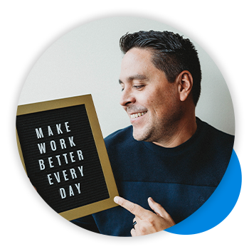 Headshot Quantum Workplace employee holding a letter board that says make work better every day.